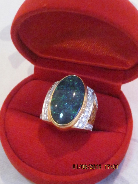history of black opals,opal ring,opal ring diamond and 18 ct gold,black opal ring