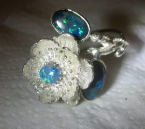 opal ring with 3 opal gemstones.