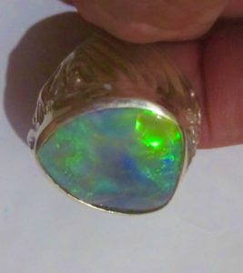 Green colour opal ring.